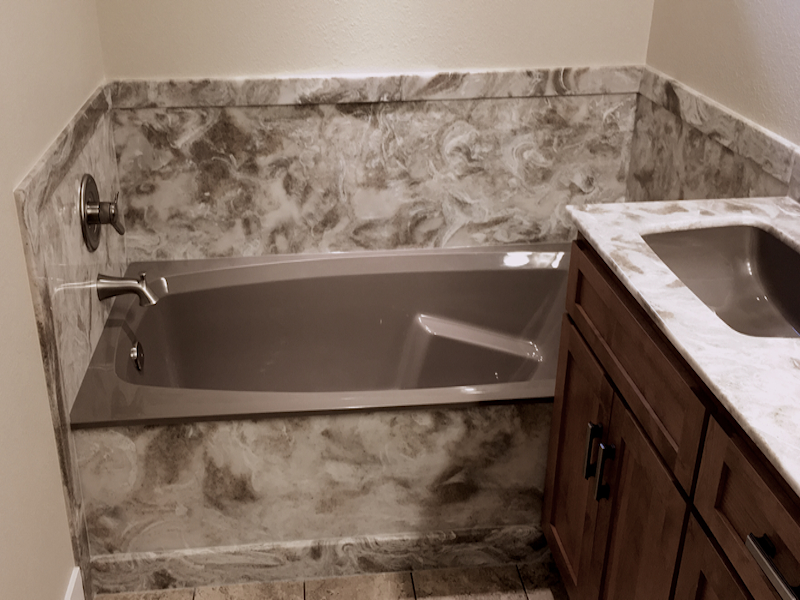 Tub and vanity using cultured onyx: cultured-onyx-tub-counter-119a